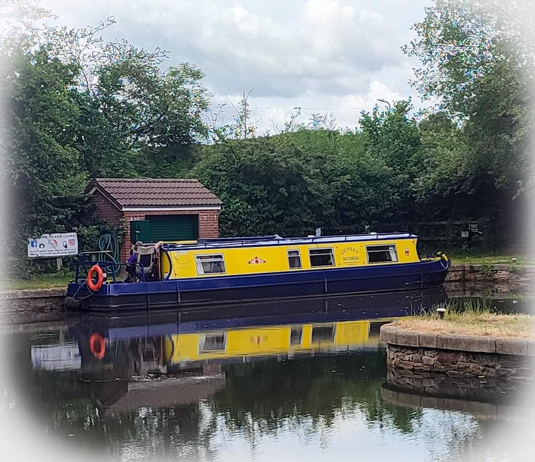 A narrowboat at five locks basin on the Mon & Brec canal