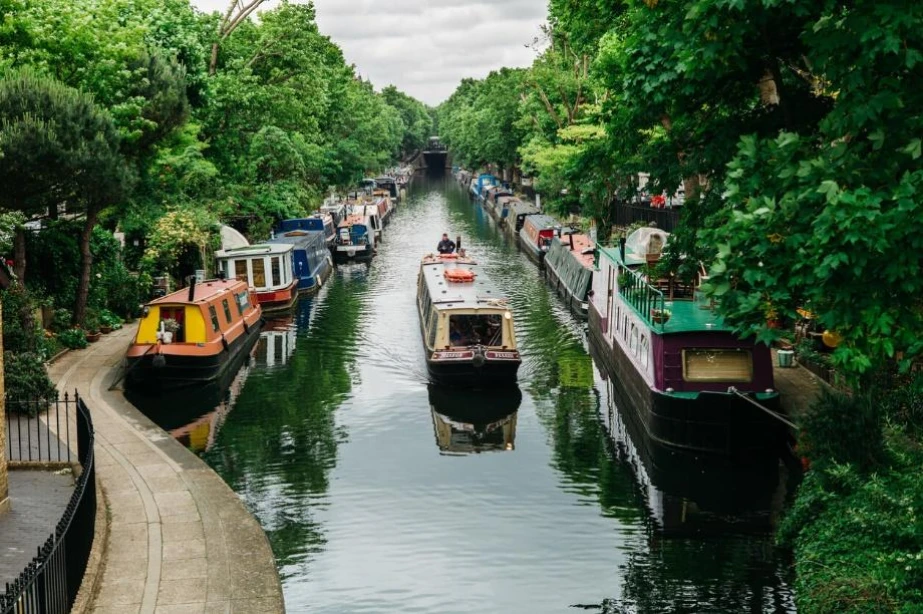 A canal boat cruising along the canal