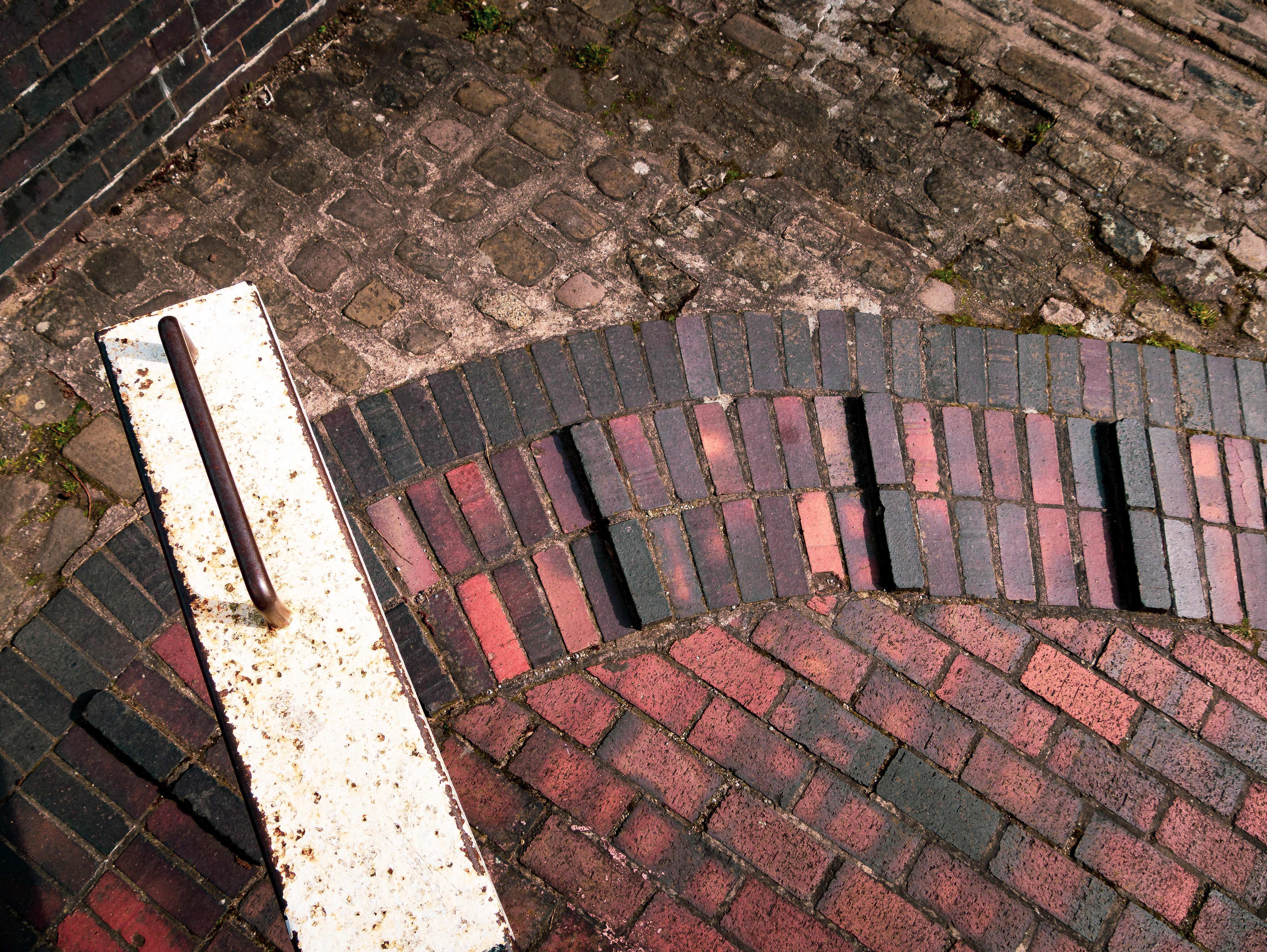 A canal lock viewed from above making it resemble a clock face, highlighting the time remaining to book a last minute canal boat hire