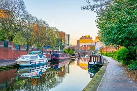 Narrowboat moored in the city of birmingham on the canal