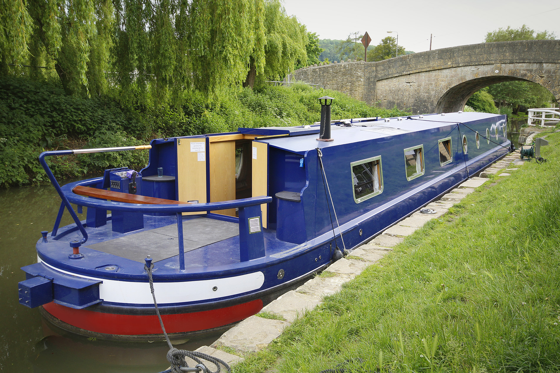 Holiday widebeam Larkspur moored up on the Kennet & Avon Canal